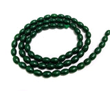 1 String 6x4mm Jaipuri Beads Dark Green Oval